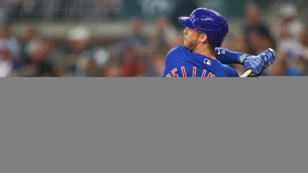 Sep 26, 2023; Atlanta, Georgia, USA; Chicago Cubs first baseman Cody Bellinger (24) hits a single against the Atlanta Braves in the second inning at Truist Park. Mandatory Credit: Brett Davis-USA TODAY Sports